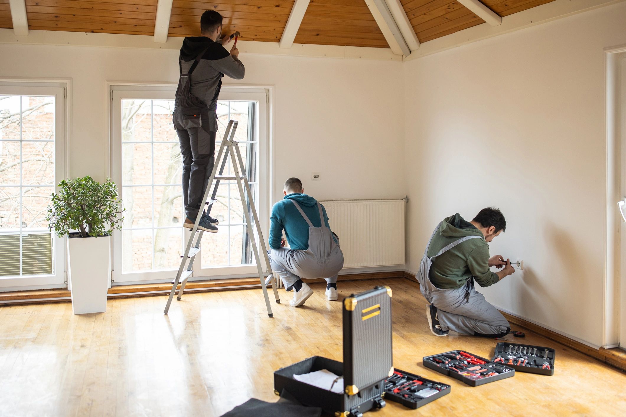 Maintenance professionals coordinating work inside a home