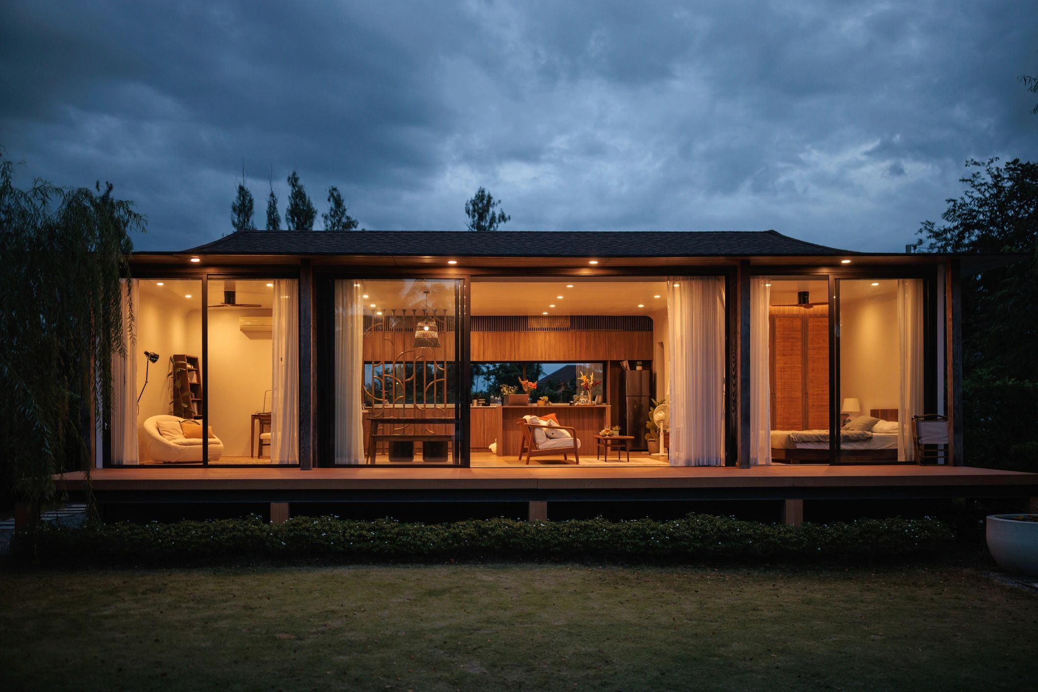 Well-maintained lakefront estate exterior at dusk