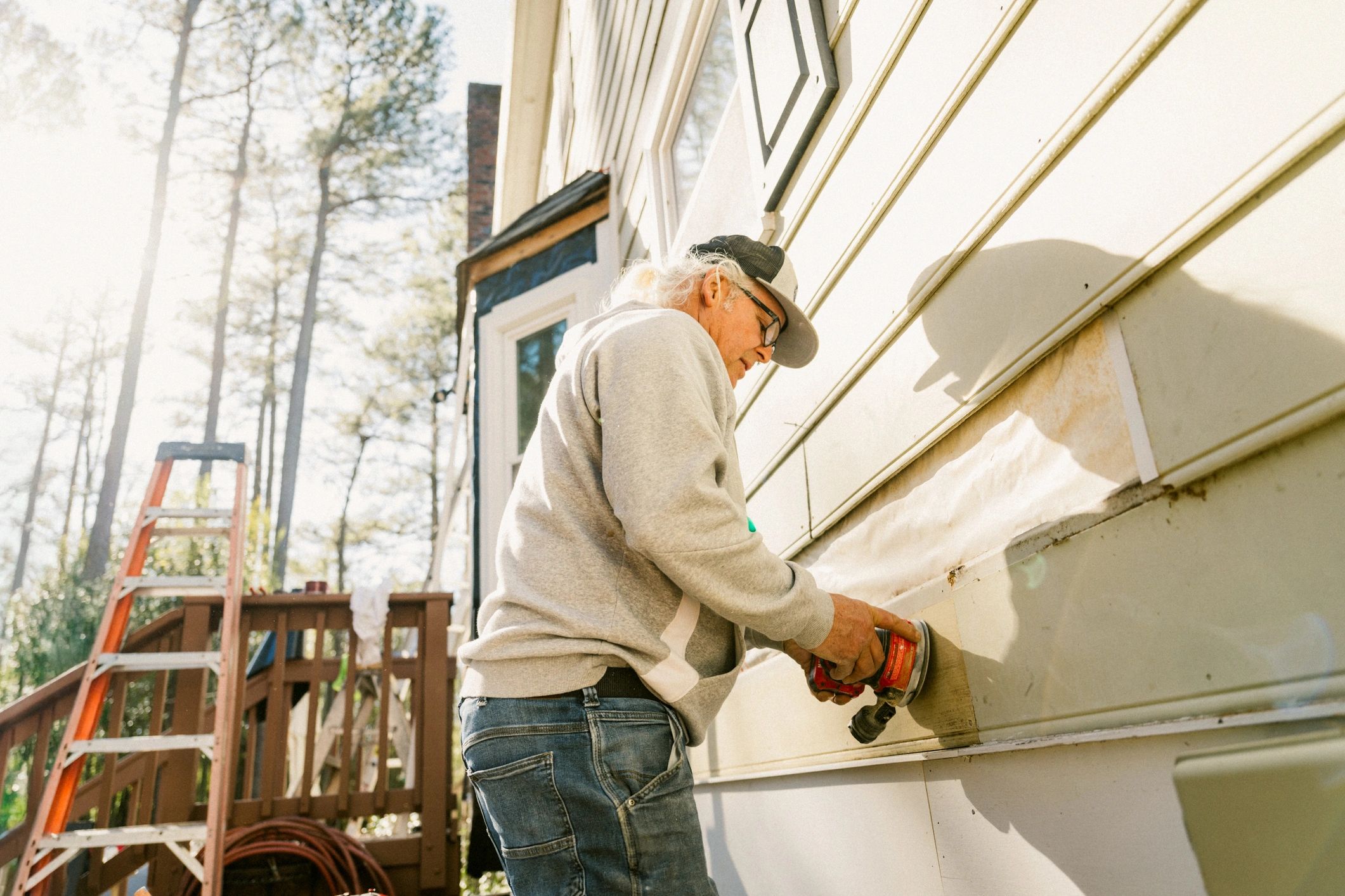 Maintenance professional inspecting exterior repairs